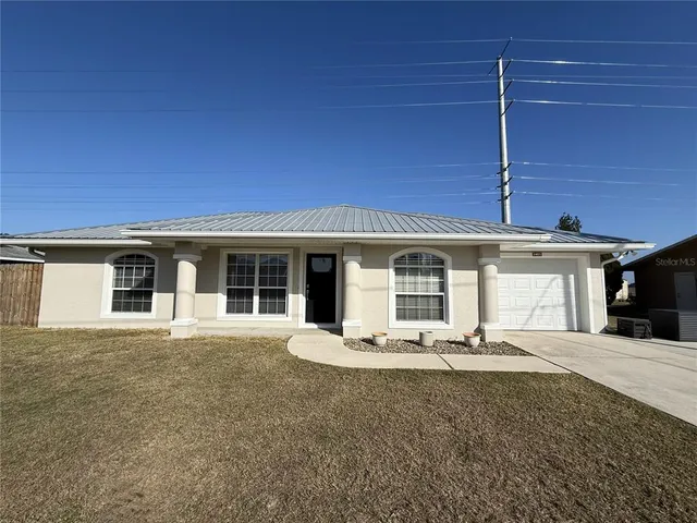 a front view of a house with a patio