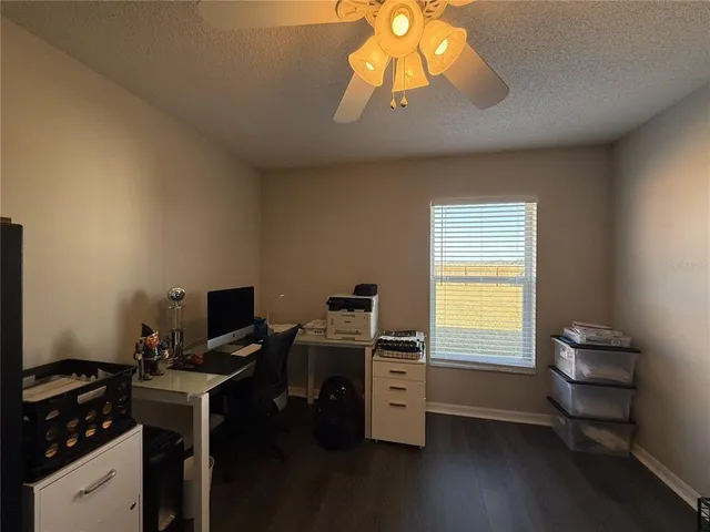 a bathroom with a sink a toilet a mirror and shower curtain