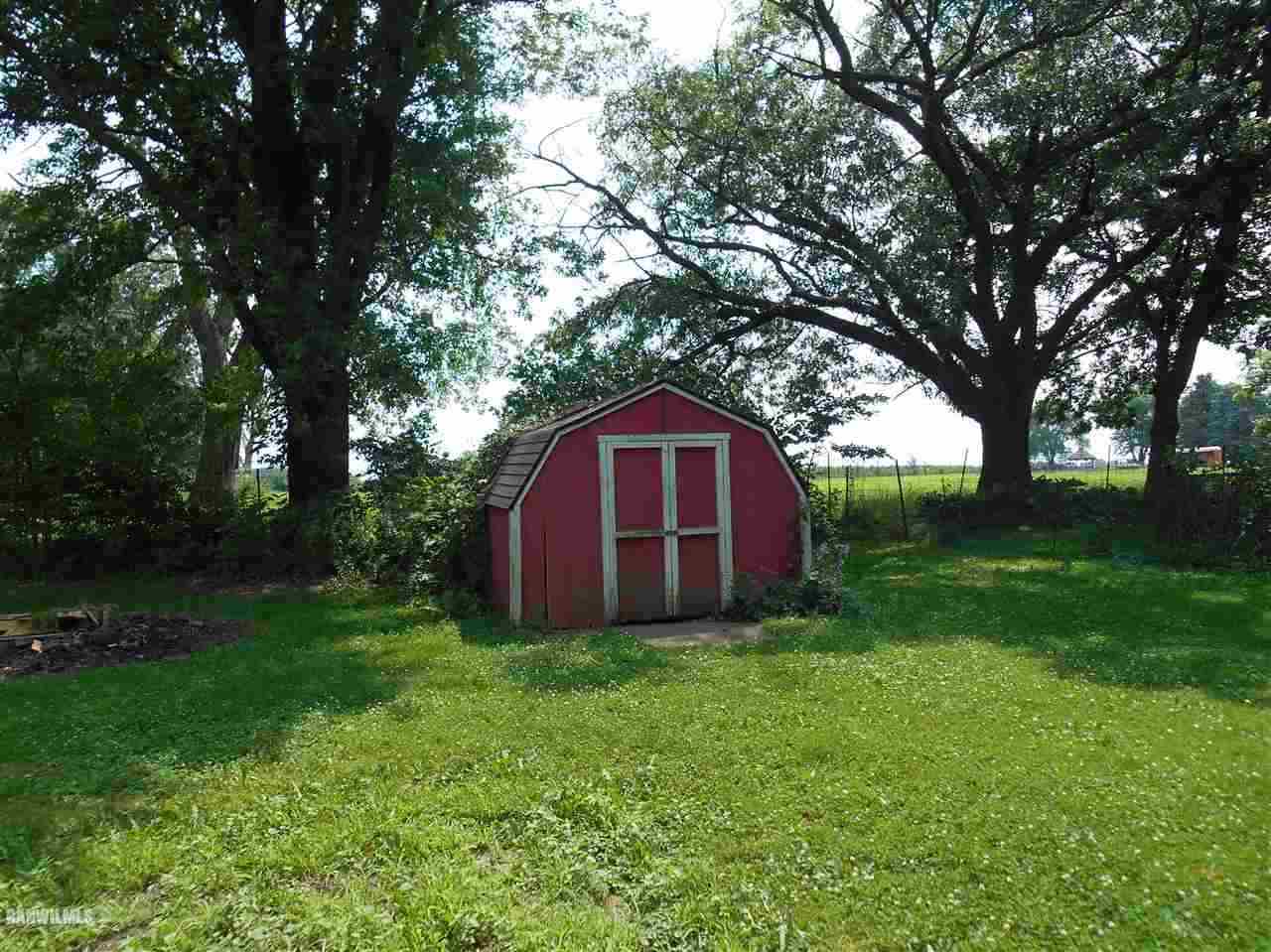 2321 Lancaster Heights Road Freeport, IL 61032 - Photo 17 of 17 a view of a large barn with large trees