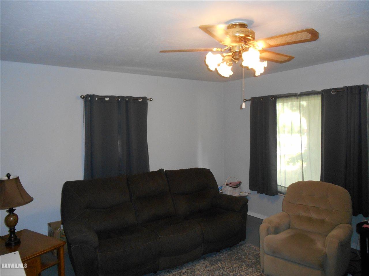 2321 Lancaster Heights Road Freeport, IL 61032 - Photo 3 of 17 a living room with furniture flowerpot and window