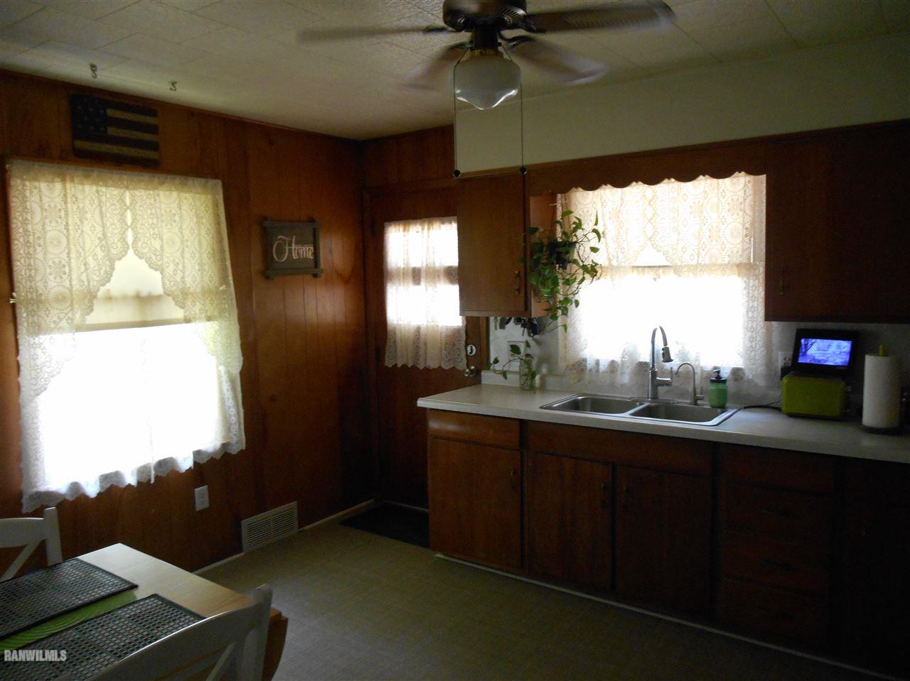2321 Lancaster Heights Road Freeport, IL 61032 - Photo 4 of 17 a kitchen with a sink window and cabinets