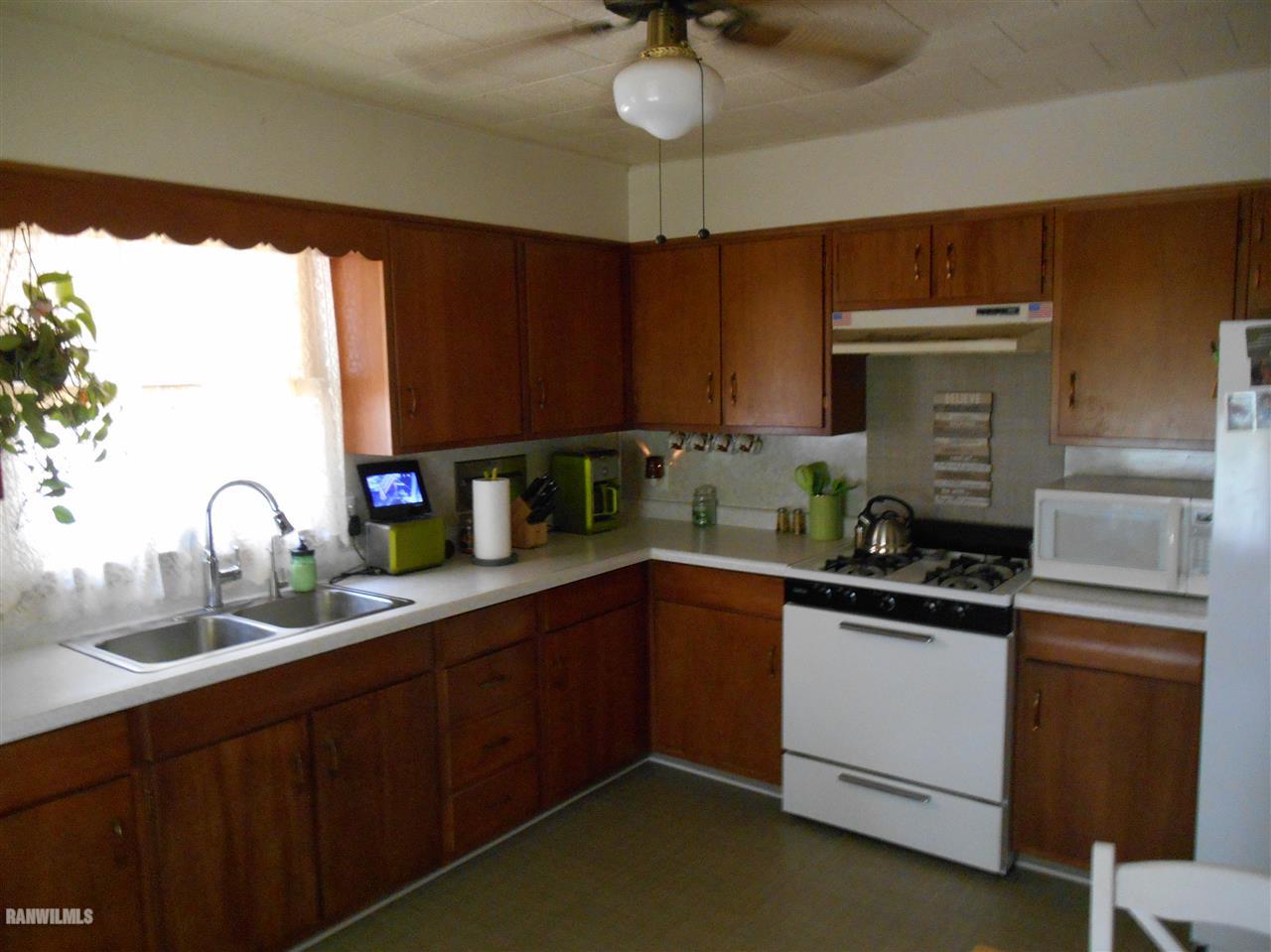 2321 Lancaster Heights Road Freeport, IL 61032 - Photo 5 of 17 a kitchen with granite countertop a sink stainless steel appliances and cabinets