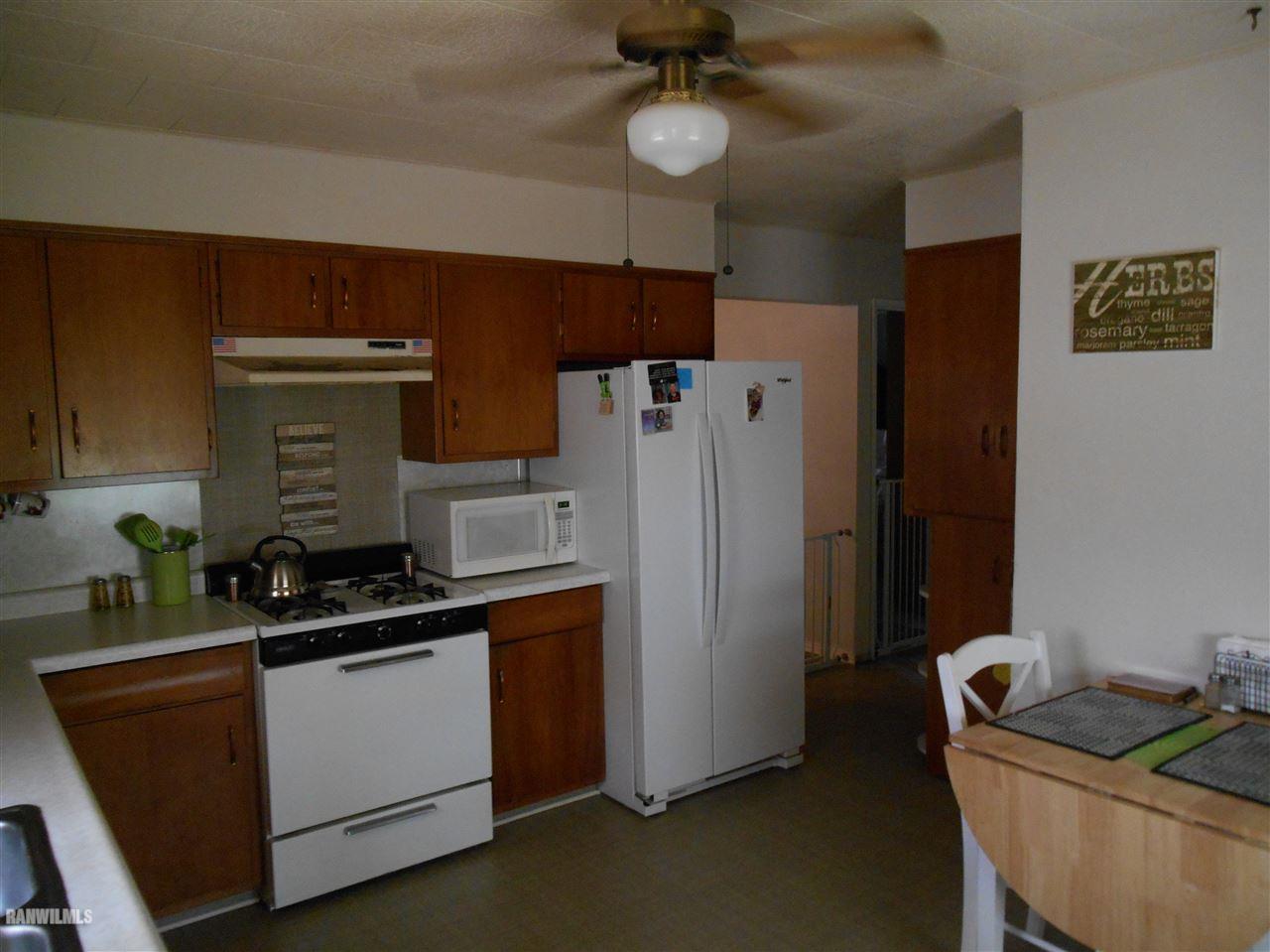 2321 Lancaster Heights Road Freeport, IL 61032 - Photo 6 of 17 a kitchen with a refrigerator and a sink
