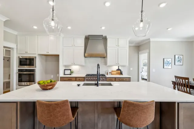 a bathroom with double vanity sinks and a mirror