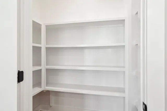 a bath room with a toilet a bath tub and a shower