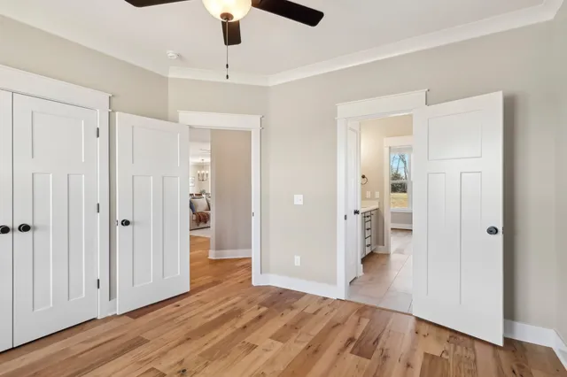 a bathroom with a toilet a sink and shower