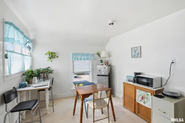 a view of a workspace with furniture