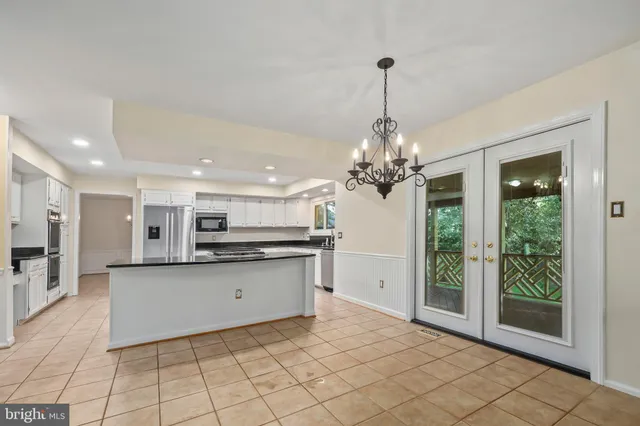 an empty room with furniture and a fireplace