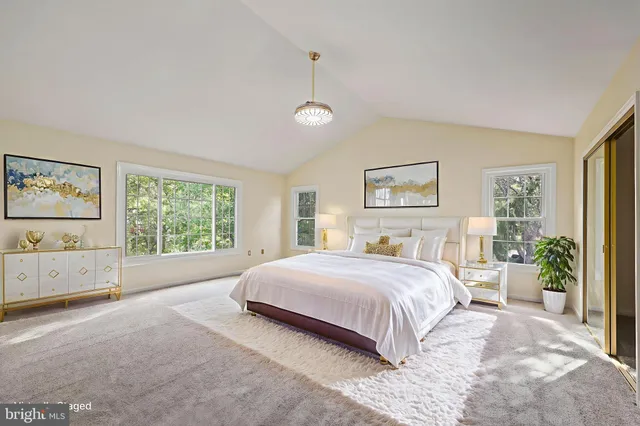 an empty room with cabinet and windows