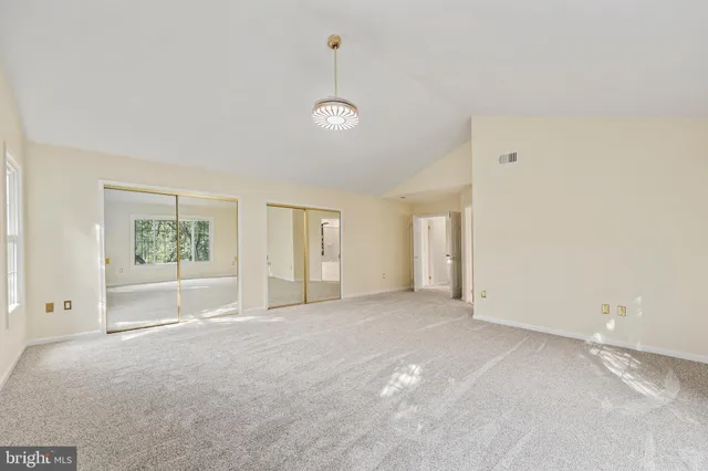 a bathroom with a toilet sink and a mirror