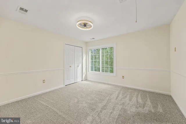 a view of a room with a fan