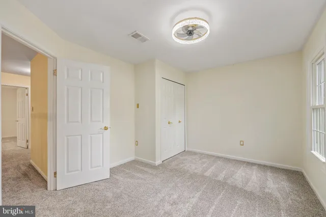 a view of a room with a wooden walls