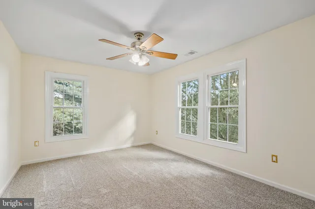 a bathroom with a shower and toilet