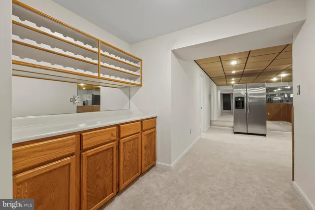 a view of a house with a big yard and large trees