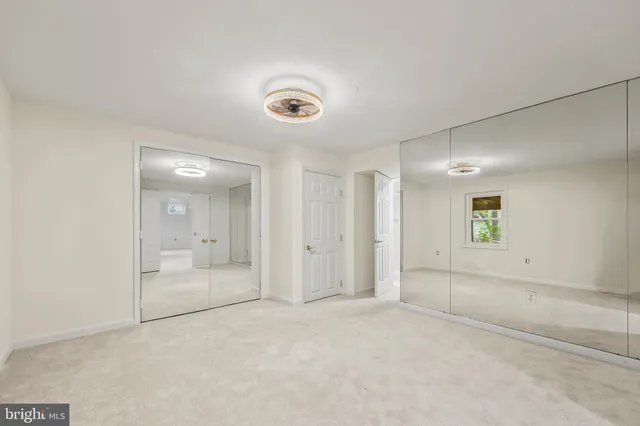 a front view of a house with a yard table and chairs