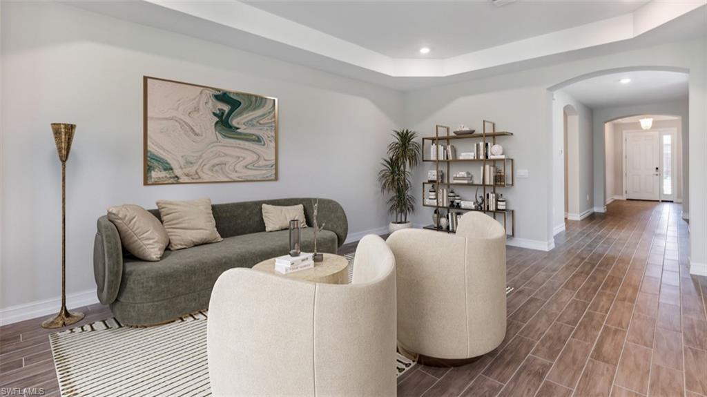 17959 Shade Tree Loop Punta Gorda, FL 33982 - Photo 5 of 12 a living room with furniture and wooden floor