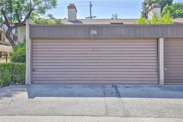 a house that has a tree in front of it