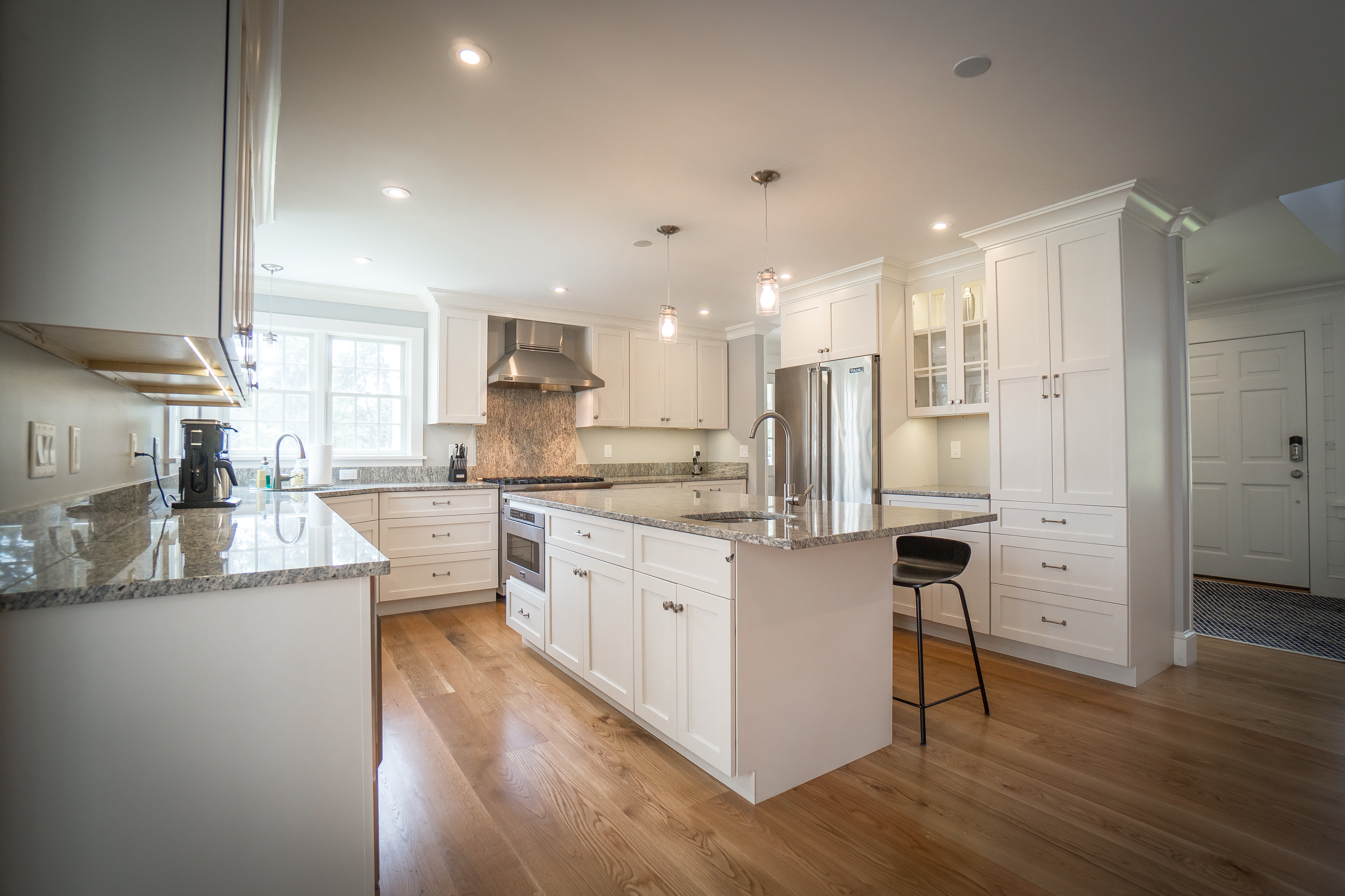50 Lovers Lane Nantucket, MA 02554 - Photo 10 of 34 a kitchen with stainless steel appliances kitchen island granite countertop a refrigerator a oven a sink and white cabinets with wooden floor