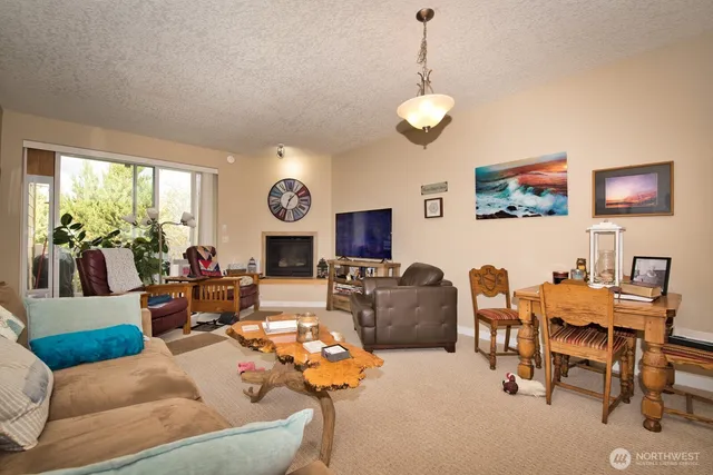 a bathroom with a granite countertop sink a toilet and shower