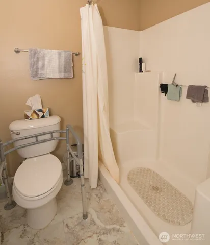 a bed room with a bed and a window