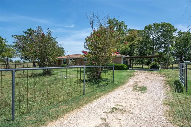 a view of a backyard with a lake view