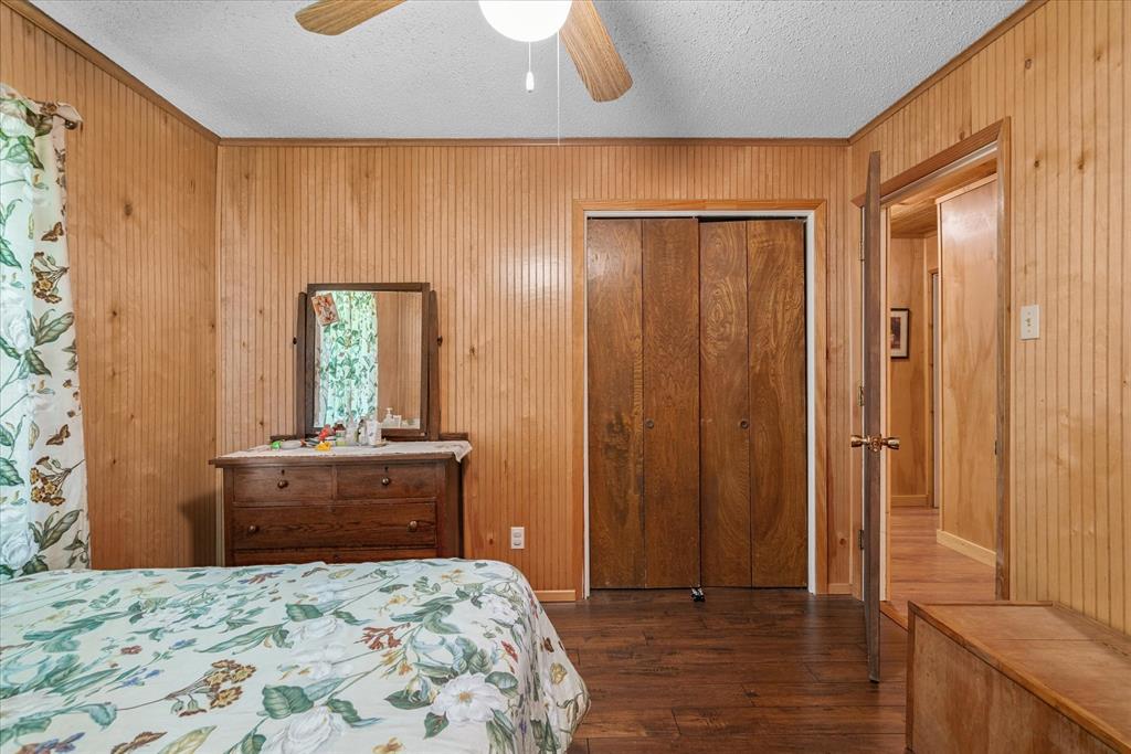 15374 Fm 2728 Terrell, TX 75161 - Photo 22 of 39 a bedroom with a bed and a dresser