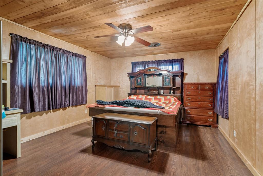 15374 Fm 2728 Terrell, TX 75161 - Photo 25 of 39 a bedroom with a bed and a chandelier