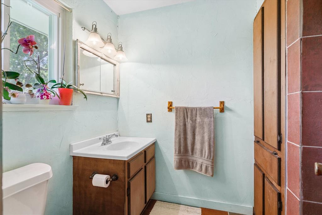 15374 Fm 2728 Terrell, TX 75161 - Photo 27 of 39 a bathroom with a sink vanity and toilet