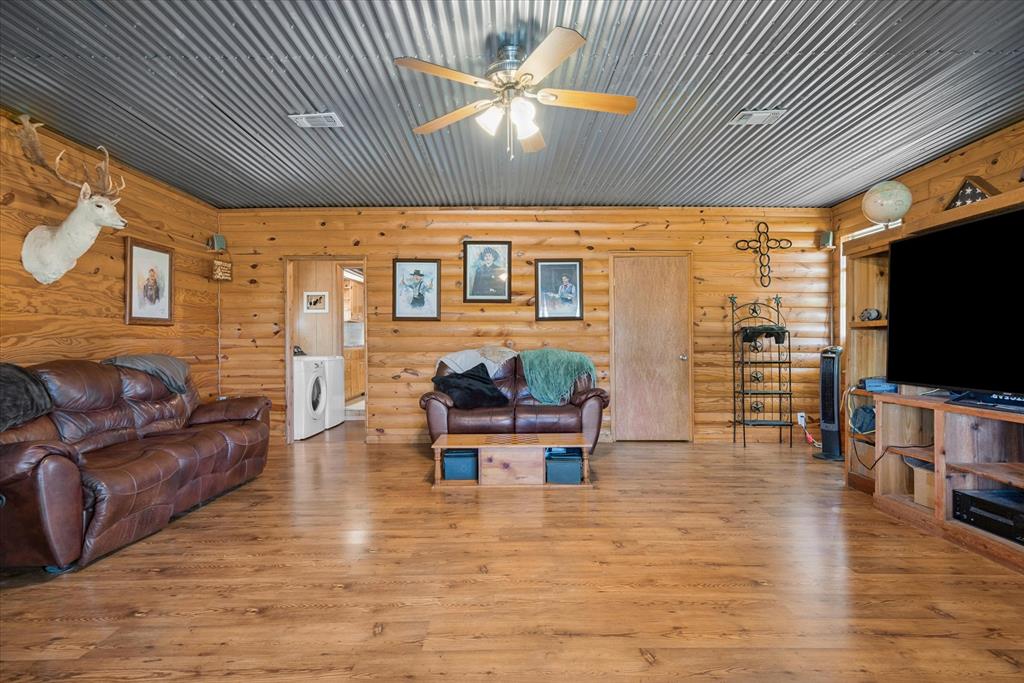 15374 Fm 2728 Terrell, TX 75161 - Photo 33 of 39 a living room with furniture and a flat screen tv