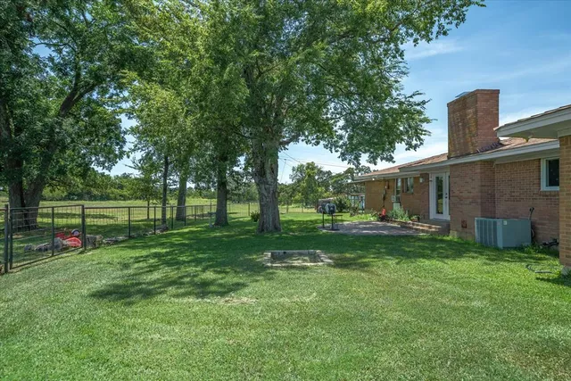 a view of a park with large trees