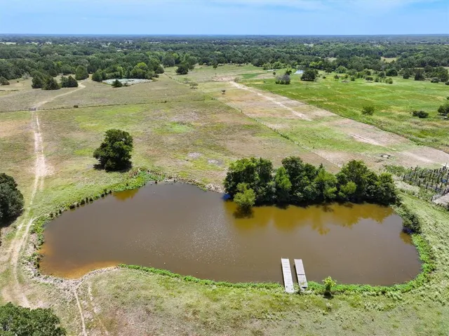 a view of a lake with a yard and lake view