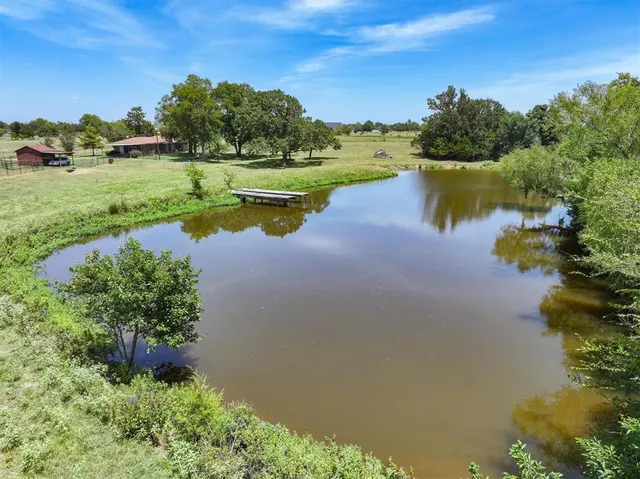 a view of a lake with a yard