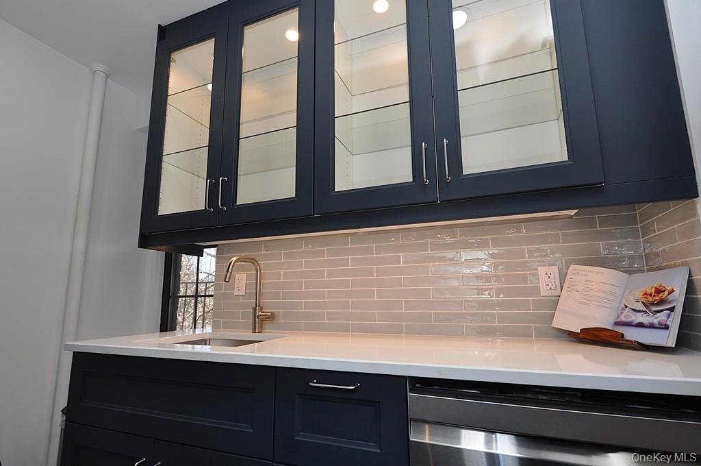 196 Garth Road, Unit 1G Scarsdale, NY 10583 - Photo 13 of 35 a kitchen with a sink and a window