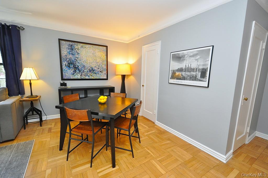 196 Garth Road, Unit 1G Scarsdale, NY 10583 - Photo 17 of 35 a view of a dining room with furniture and wooden floor