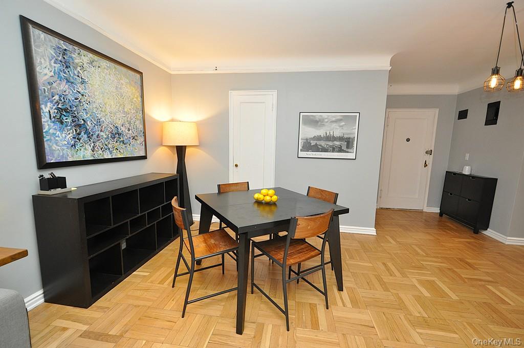 196 Garth Road, Unit 1G Scarsdale, NY 10583 - Photo 18 of 35 a view of a dining room with furniture and wooden floor
