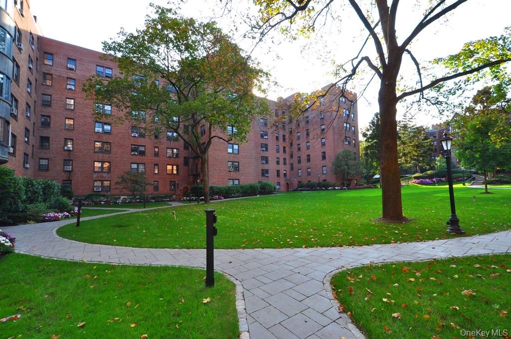 196 Garth Road, Unit 1G Scarsdale, NY 10583 - Photo 25 of 35 a view of a garden with a building