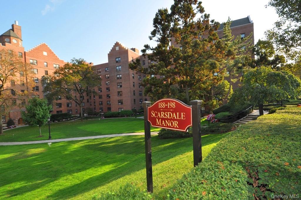 196 Garth Road, Unit 1G Scarsdale, NY 10583 - Photo 5 of 35 a sign on the side of the road