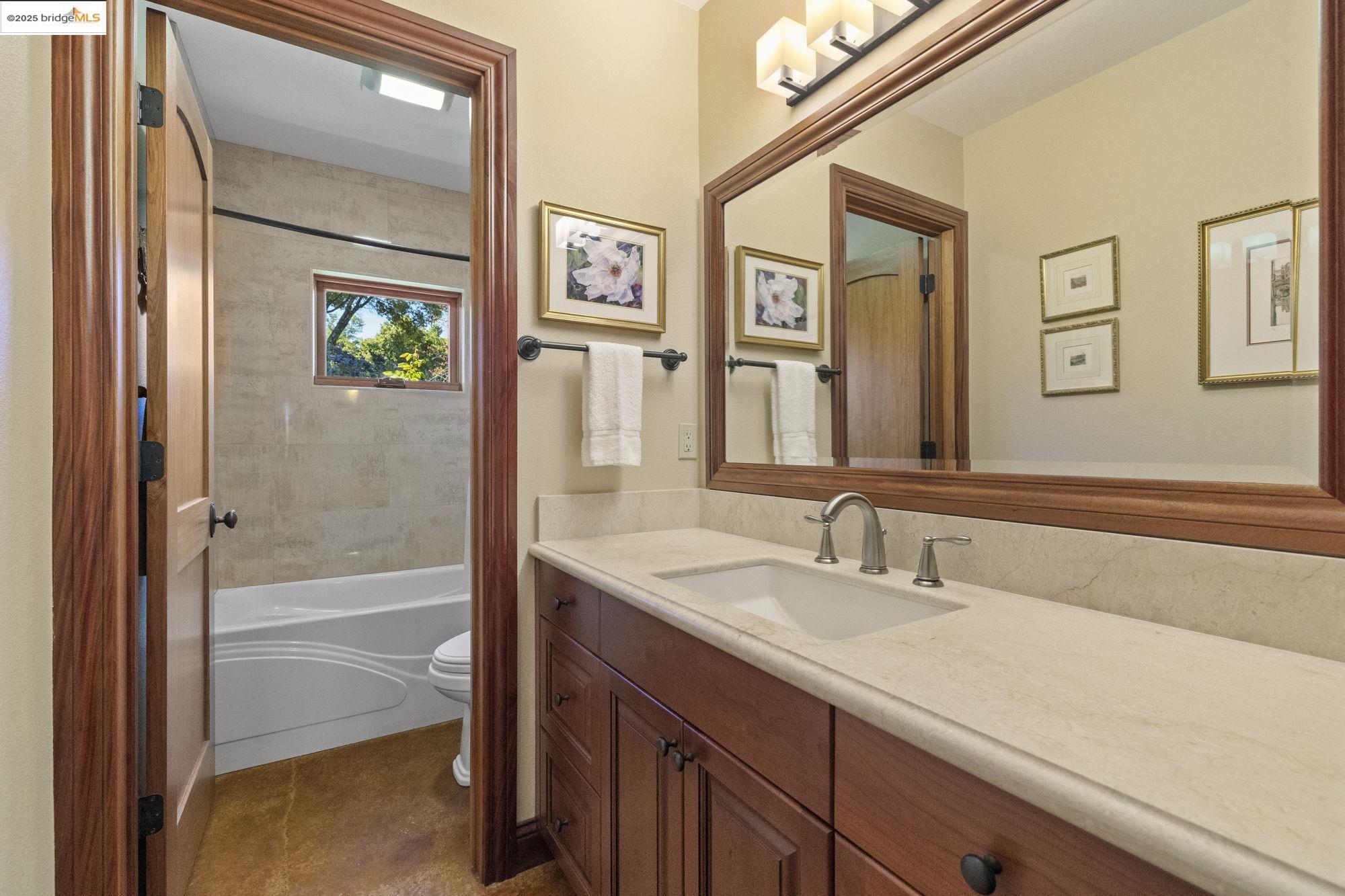 10270 Slate Rim Road Sonora, CA 95370 - Photo 33 of 55 a bathroom with a sink a vanity and a mirror