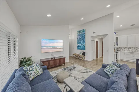 a large kitchen with a table and chairs
