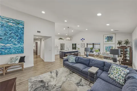 a kitchen with stainless steel appliances granite countertop a refrigerator sink and stove