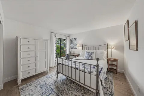 a bedroom with a large bed and a table