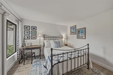 a bedroom with a large bed and furniture