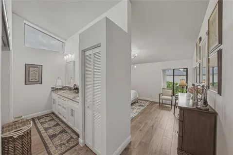 a bathroom with double sink and a mirror