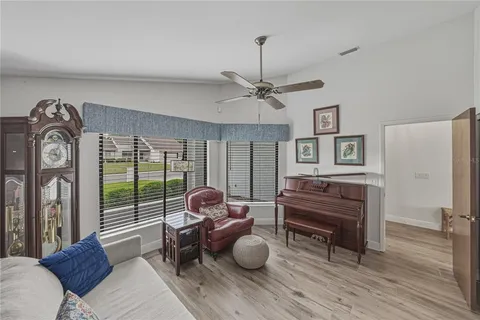 a living room with furniture and a large window