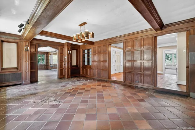 a view of a livingroom with an empty space and a fireplace