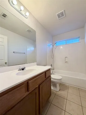 a bathroom with a sink a toilet and a bathtub