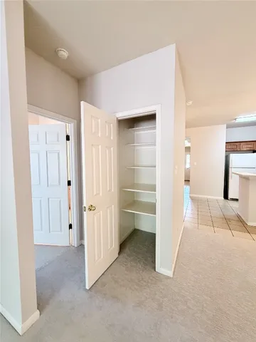 a view of a room with a furniture and a bathroom