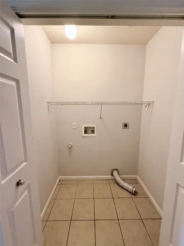 a view of a small space with racks on the wall