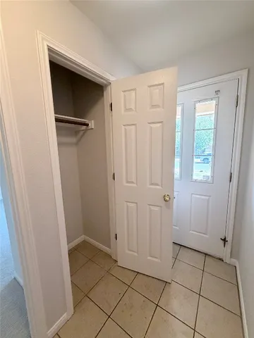 a view of a closet area in a room