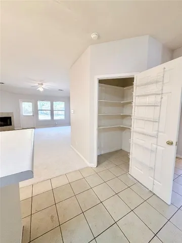 a view of an empty room and window